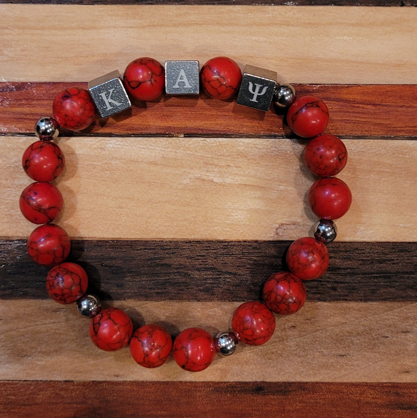 Metal Kappa Alpha Psi bracelet with marble beads